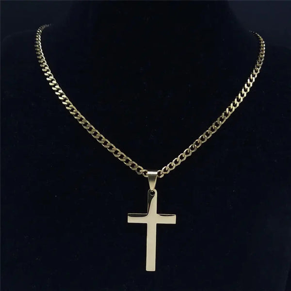 Gold chain necklace with a cross pendant on a black background