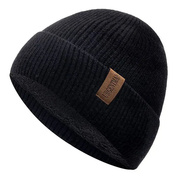 Black knit beanie with a brown leather patch on a white background