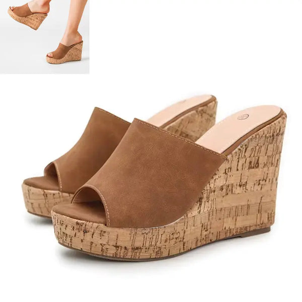 Brown wedge sandals with cork wedge on a white background