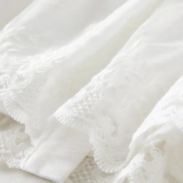 Close-up of white textured fabric on a light background