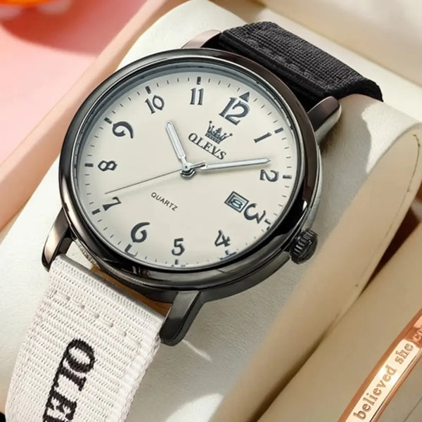 Watch with black and white strap on a light background