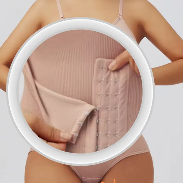 Close-up of a beige shapewear garment with a white circle highlighting the material and design.