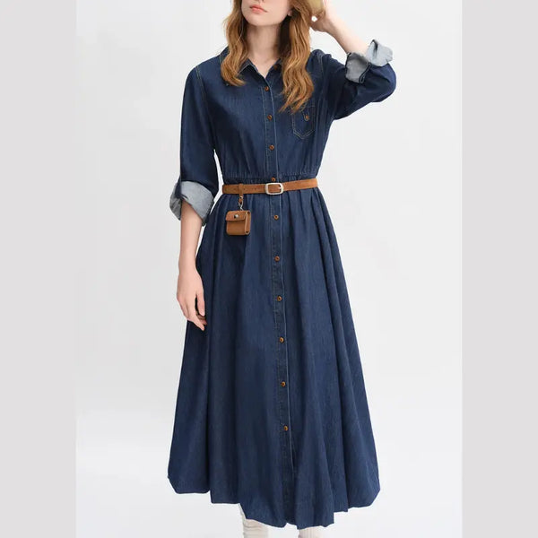 Woman wearing a blue denim dress with a belt on a white background