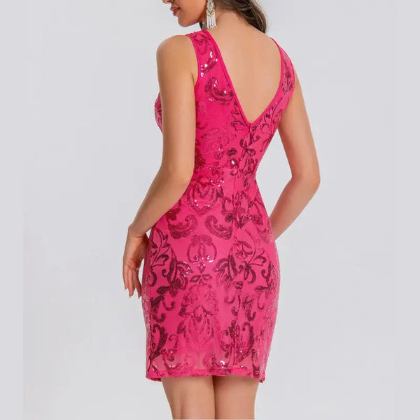 Pink lace dress with black floral pattern on a white background