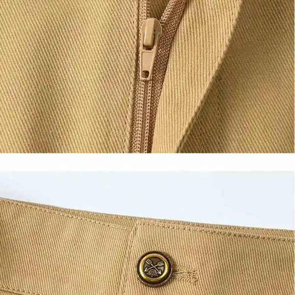 Close-up of a beige jacket with a zipper and button on a white background
