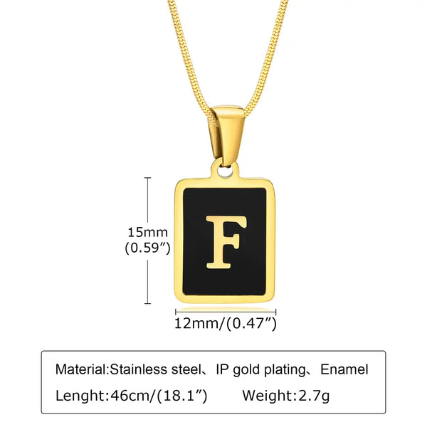 Gold necklace with a black square pendant featuring the letter 'F', showing measurements and material details.