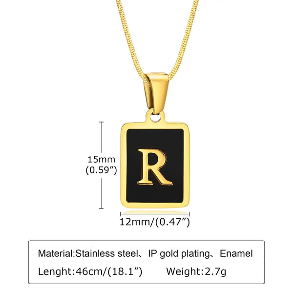 Gold necklace with a black square pendant featuring the letter 'R', showing measurements and material details.