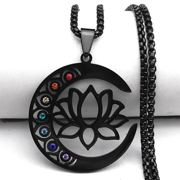 Black crescent moon and lotus flower pendant with colorful stones on a black chain against a white background.