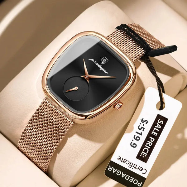 Rose gold watch with black face on a beige surface, featuring a sale tag.