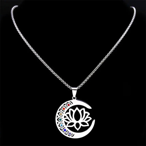 Silver necklace with a lotus flower pendant on a black background