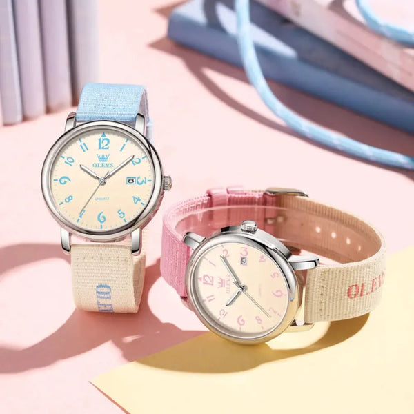 Two watches with pastel-colored straps on a light background