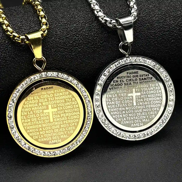 Two religious pendants, one gold and one silver, on a dark background.