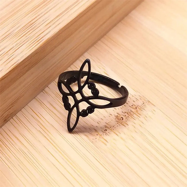 Black decorative ring on a wooden surface