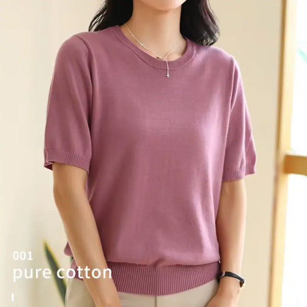 Person wearing a purple short-sleeve shirt with '001 pure cotton' text on a neutral background