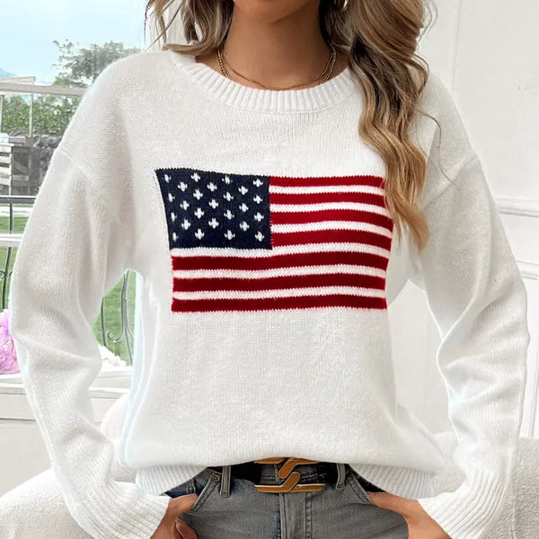 White sweater with American flag design worn by a person.