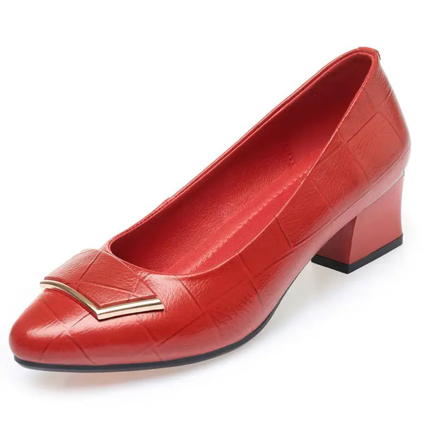 Red high-heeled shoe with a gold accent on a white background