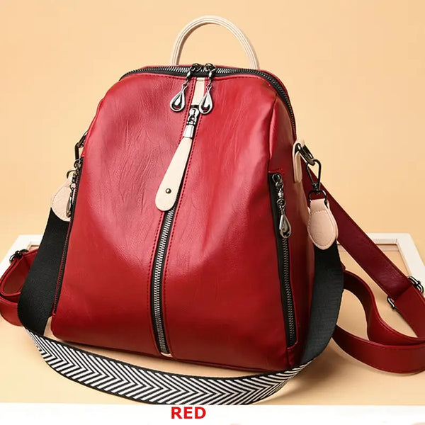 Red backpack with black straps on a beige background