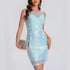 Light blue sequin dress worn by a model on a white background