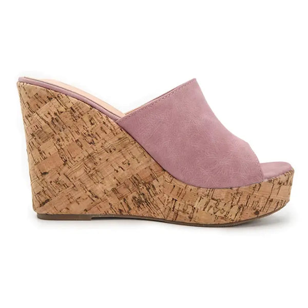 Pink wedge sandal with cork wedge on a white background