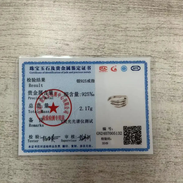 Certificate of identification for silver ring with 925 purity on a white background