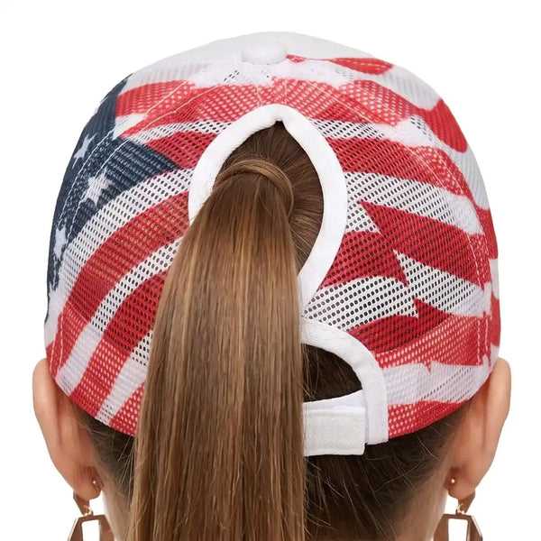Rear view of a person wearing a mesh baseball cap with an American flag pattern, featuring red and white stripes and white stars on a blue field, with a white adjustable strap.