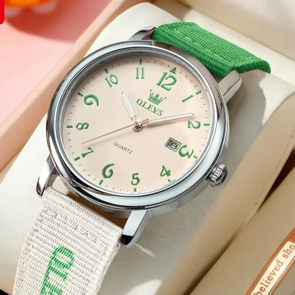 Watch with green strap and face on a light background
