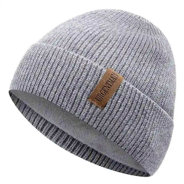 Gray knit beanie with a brown leather patch on a white background