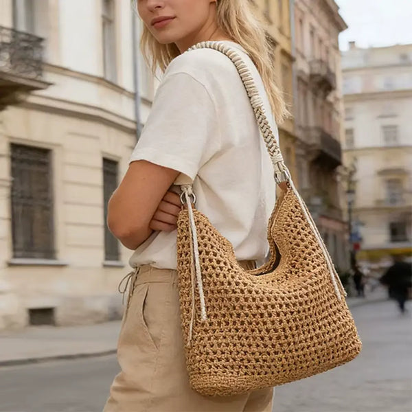 Woman carrying a woven bag on a city street