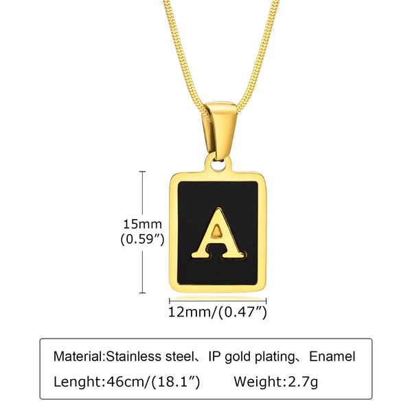 Gold necklace with a black square pendant featuring the letter 'A', showing measurements and material details.
