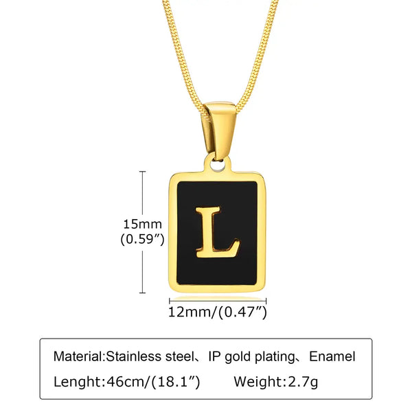 Gold necklace with a black square pendant featuring the letter 'L', showing measurements and material details.