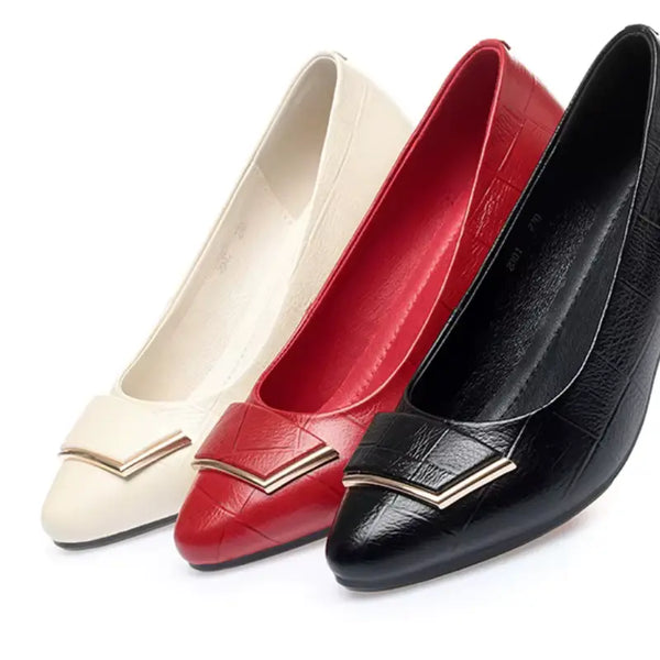 Three women's shoes in white, red, and black on a white background