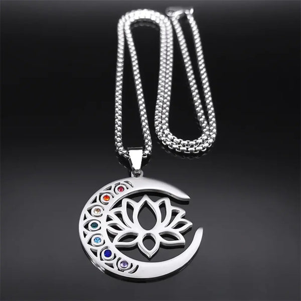 Silver necklace with a lotus flower pendant on a black background