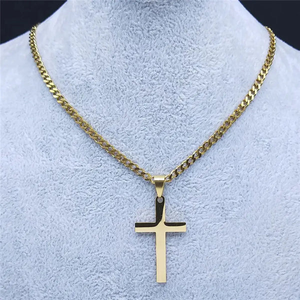Gold chain necklace with a cross pendant on a mannequin bust.
