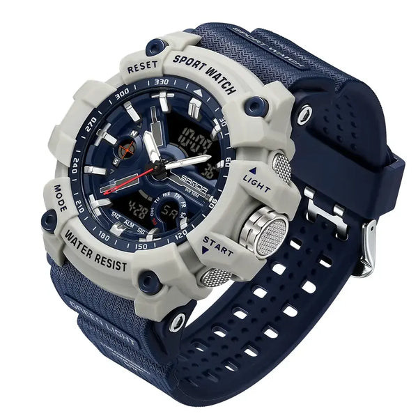 A rugged sport watch with a light gray and navy blue color scheme, featuring a textured silicone strap, a dark blue dial, and silver-tone metal buttons.