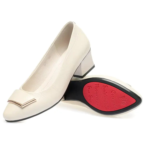 Beige shoe with a red sole on a white background