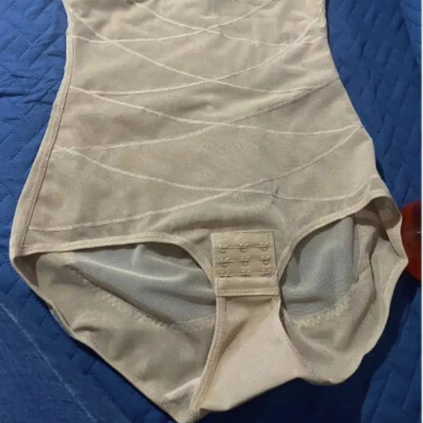 Beige shapewear on a blue textured surface