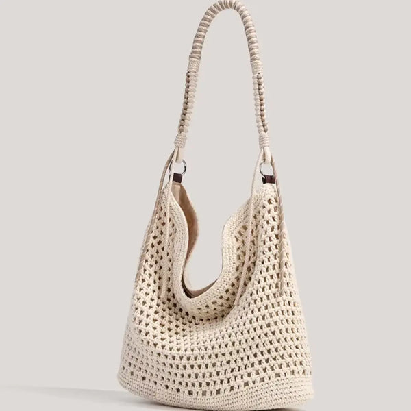 Beige woven handbag on a light gray background
