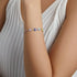 products/model-wearing-silver-bracelet.webp